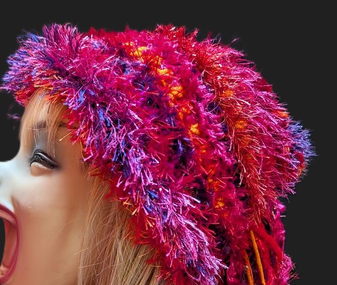 Bright Red, Hot Pink, Orange & Purple Slouchy Beanie Hat with Sparkle, Texture, Fur & Long Tail Fringe. Close-up View of Hat Crown.