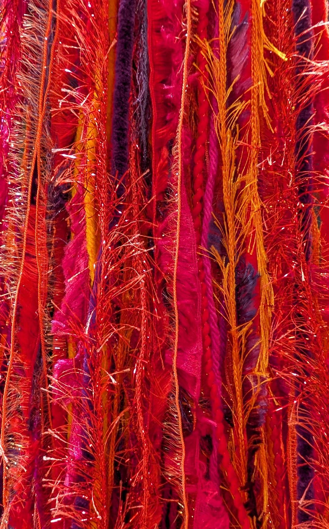Bright Red, Orange, Hot Pink & Purple Slouchy Beanie Hat with Sparkle, Texture, Fur & Long Tail Fringe. Close-up of Long Fringed Tail.