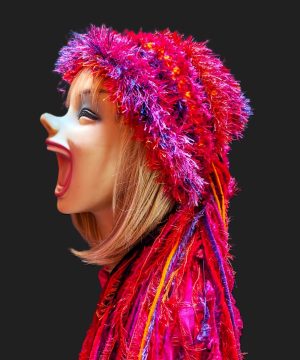 Bright Red, Hot Pink, Orange & Purple Slouchy Beanie Hat with Sparkle, Texture, Fur & Long Tail Fringe. Side View.