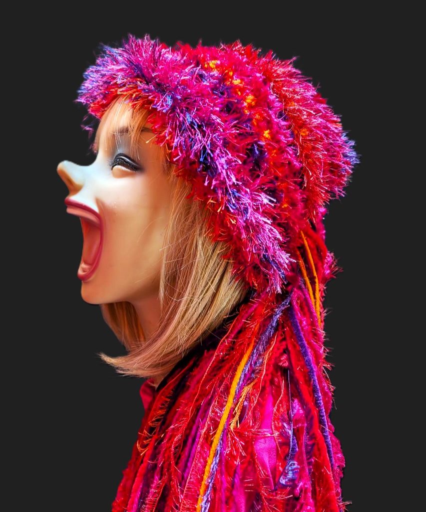 Bright Red, Hot Pink, Orange & Purple Slouchy Beanie Hat with Sparkle, Texture, Fur & Long Tail Fringe. Side View.