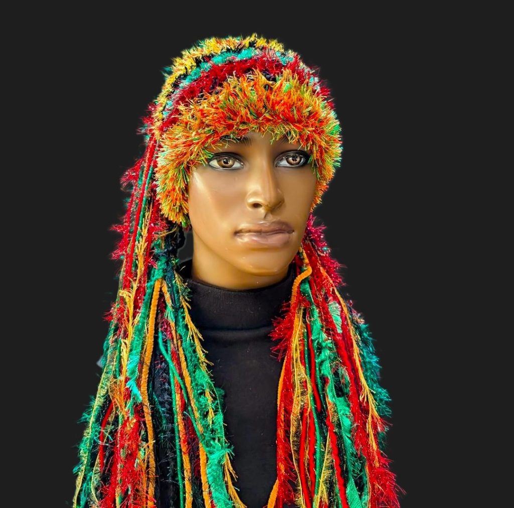 Bright Rasta Red, Black, Green, Gold Slouchy Beanie Hat with Sparkle, Texture, Fur & Long Tail Fringe. Front View.