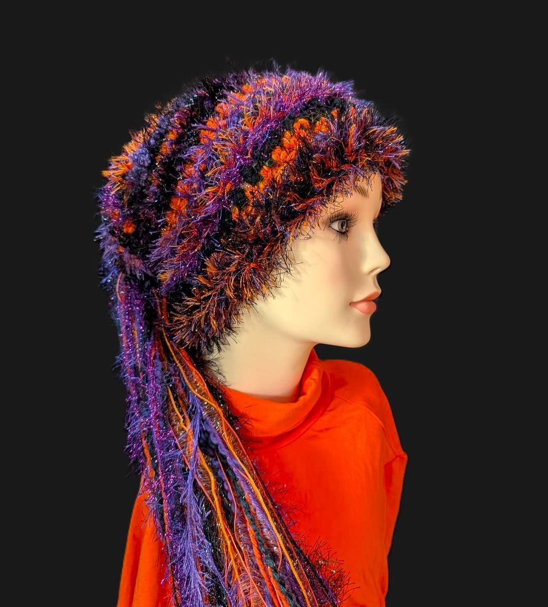 Black, Purple & Orange Halloween Slouchy Beanie Hat with Sparkle, Texture, Fur & Long Tail Fringe. Side View