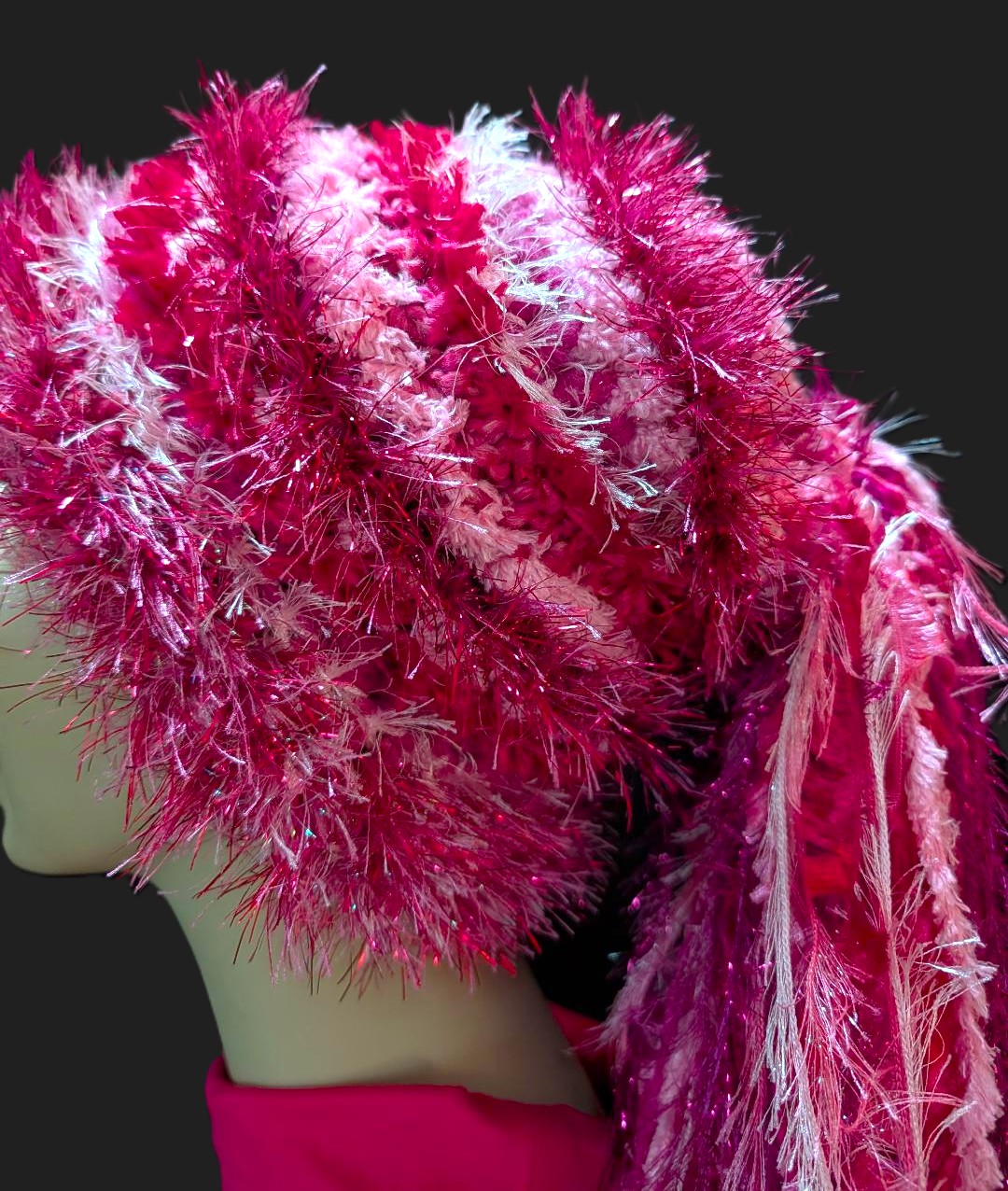 Bright Crocheted Slouchy Beanie Hat in Shades of Pink with Sparkle, Texture, Fur & Long Tail Fringe. Close-Up View of Hat Crown.