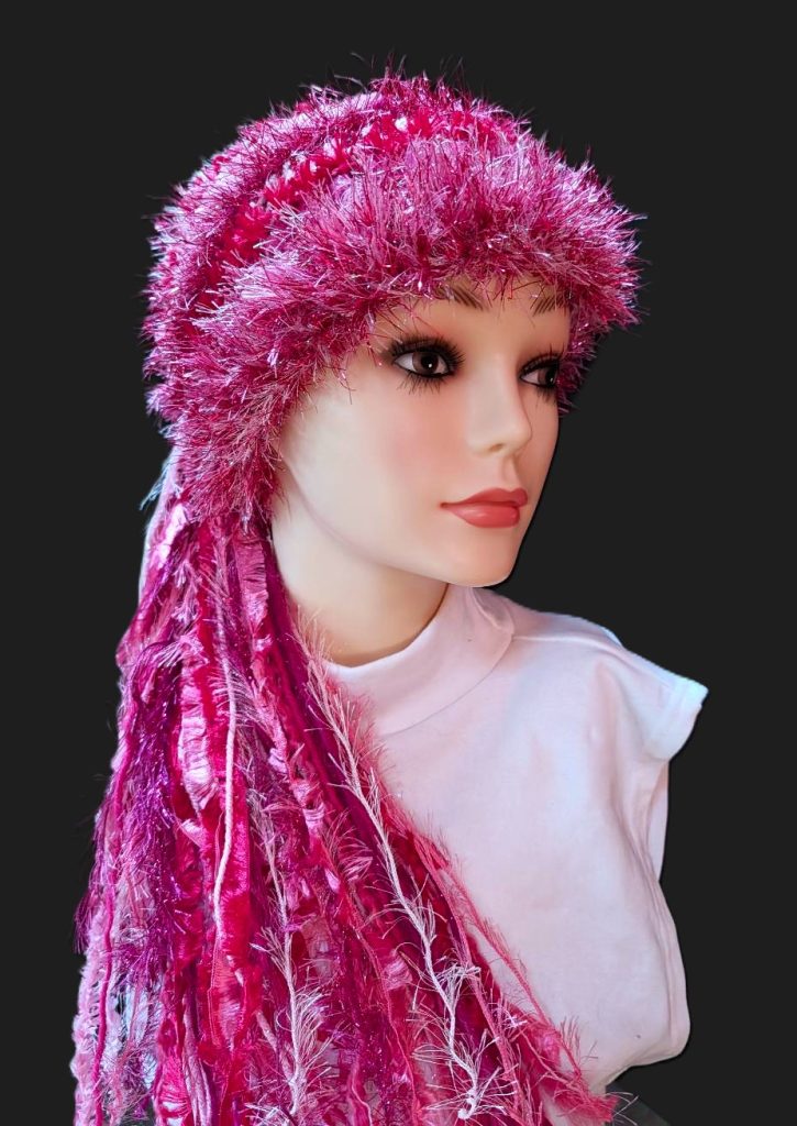 Crocheted Slouchy Beanie Hat in Shades of Pink with Sparkle, Texture, Fur & Long Tail Fringe. Front View
