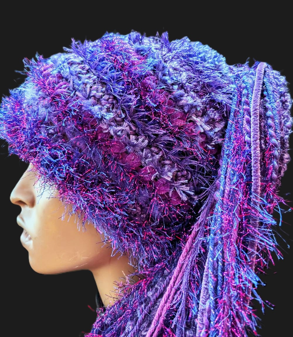 Purple Crocheted Slouchy Beanie Hat with Sparkle, Texture, Fur & Long Tail Fringe. Close-Up view of Hat Crown.
