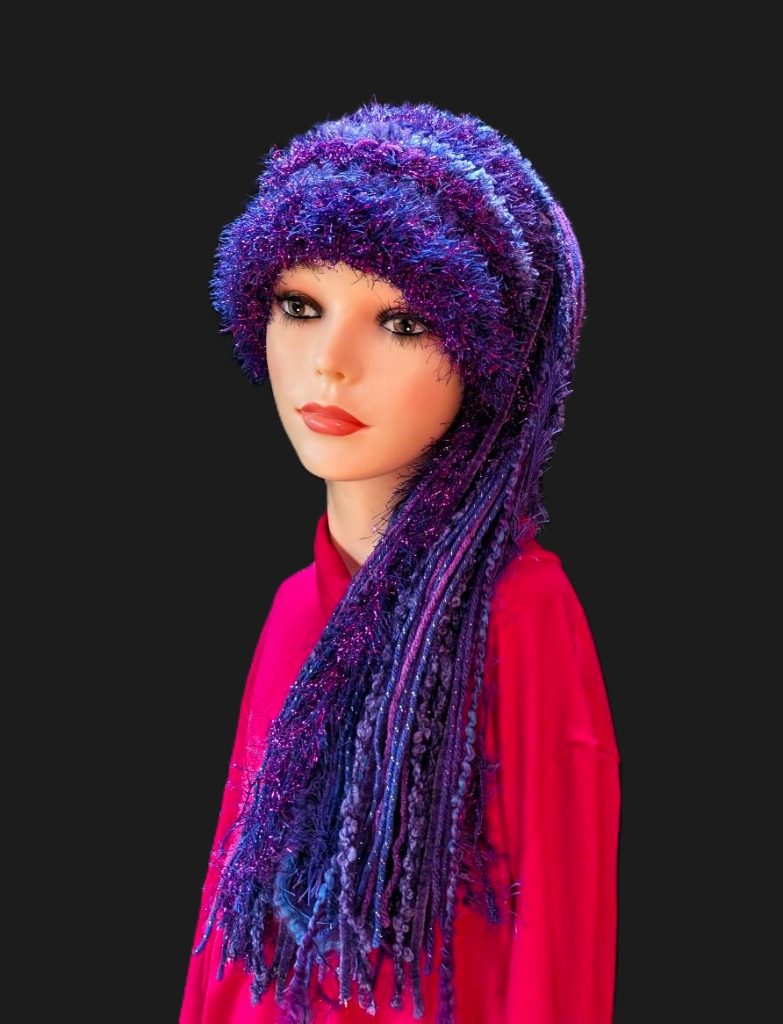Crocheted Purple Slouchy Beanie Hat with Sparkle, Texture, Fur & Long Tail Fringe. Front View.